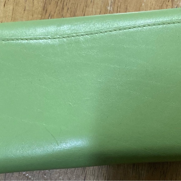 Coach wallet 7.5” wide 4” tall it only has a small black ink you can see it - Picture 2 of 7